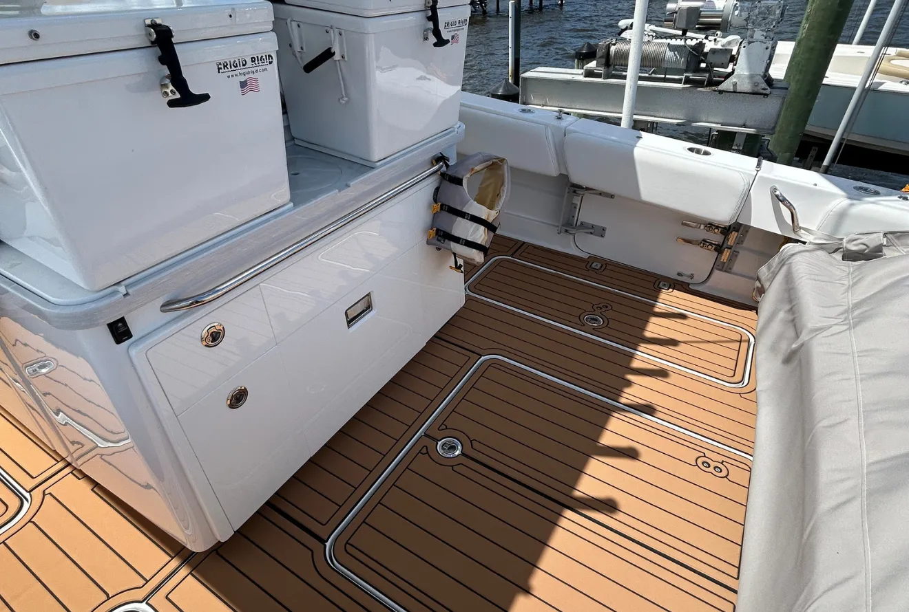 Cockpit foam decking in teak with black caulk lines