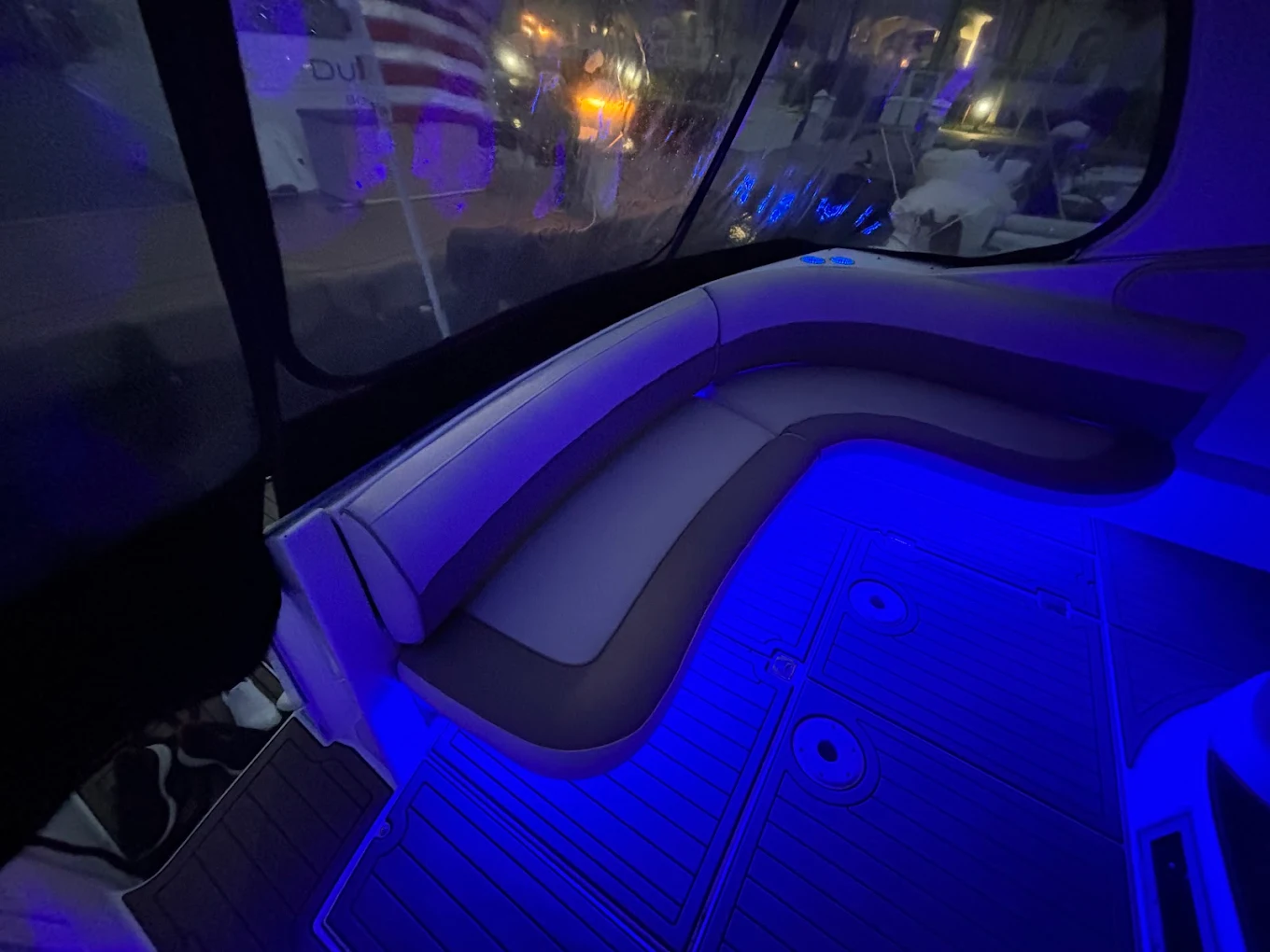 Cockpit seating with blue accent lighting at night