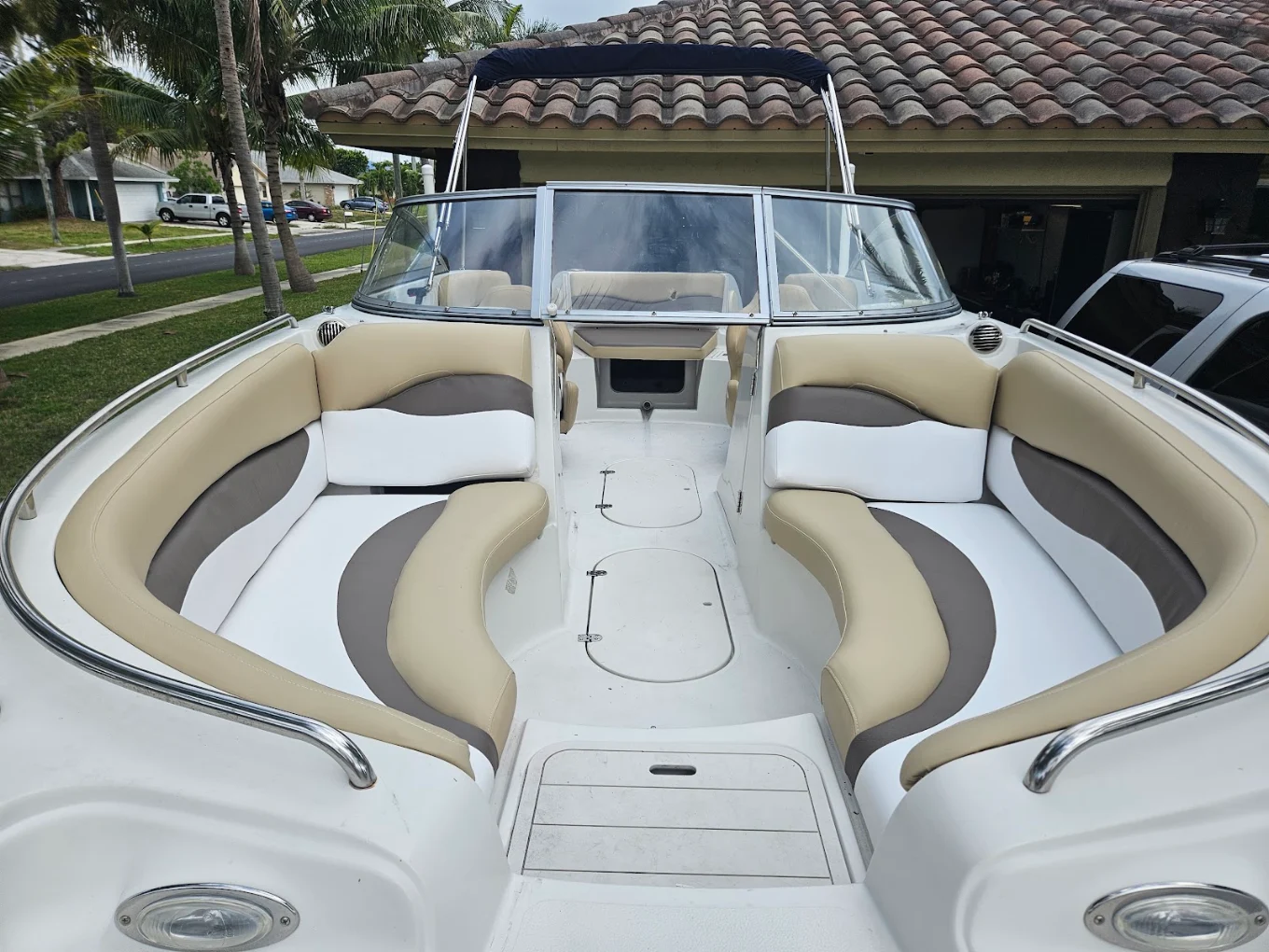 Full deck boat re-upholstery in tan and white